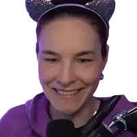 a woman wearing a purple hoodie and a headband with cat ears is smiling in front of a microphone .