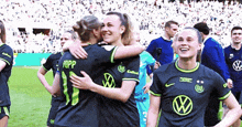 a soccer player wearing number 11 is hugging another player on the field