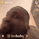 a close up of a man 's face with the words drebaby written on it