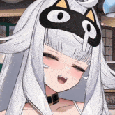 a close up of a girl wearing a mask with a cat face on it