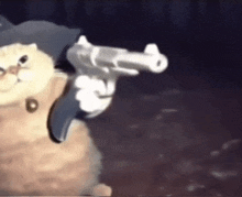 a cat in a hat is holding a gun in its hand .
