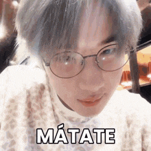 a close up of a person wearing glasses with matate written below them