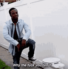 a man is standing next to a toilet and saying " why the fuck you lyin "