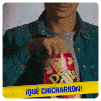 a man in a denim jacket is holding a can of dedito chips