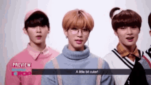 a group of young men are standing next to each other and one of them says a little bit cuter .