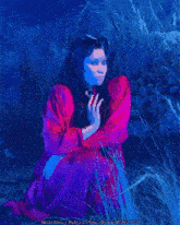 a painting of a woman in a red dress with the year 2005