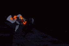 a pixel art of a person holding a torch in front of a fireball