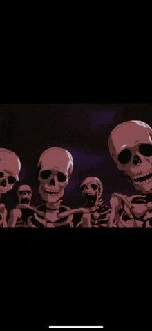 a group of skeletons are standing next to each other in a dark room and smiling .