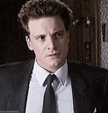 a man in a suit and tie has the word filthyfirth on the bottom right