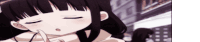a girl with long black hair is sleeping with her eyes closed .