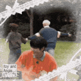 a group of people are dancing in a park with the words itzy and angie on the bottom