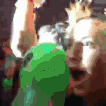 a blurry picture of a person 's face with a green background