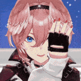 a close up of a girl 's face with a glove on her hand