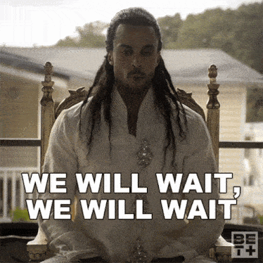 a man sitting in a chair with the words 