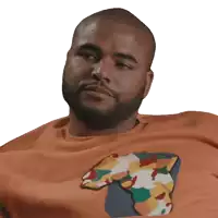 a man with a beard is wearing an orange shirt with a colorful map on it