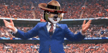 a man in a blue suit and a sombrero stands in front of a stadium that says the final adventure on it