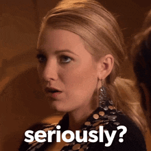 a woman with a surprised look on her face and the words seriously behind her