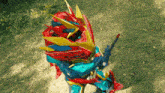 a person in a colorful costume holding a sword and shield