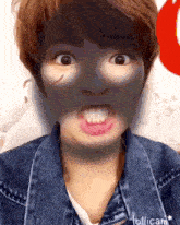 a person with a black mask on their face making a funny face .