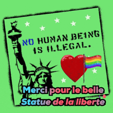 a green sign that says no human being is illegal with a statue of liberty