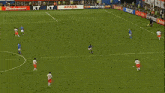 a soccer game is being played in front of a banner that says mib hons