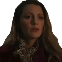 a close up of a woman 's face with her mouth open and a scarf around her neck