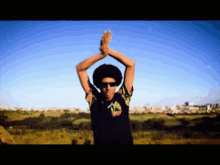 a pixelated image of a man wearing sunglasses and a shirt that says ' a.m. ' on it