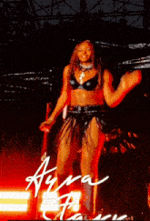 a woman is standing on a stage with the name ayra written on the bottom