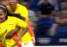 a soccer player wearing a yellow shirt with the number 1 on it