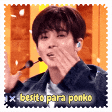 a postage stamp with a young man blowing a kiss and the words " besito para ponko "