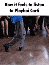 a man is dancing on a dance floor with the words how it feels to listen to playboi carti below him