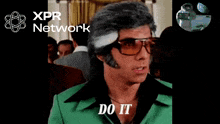 a man wearing sunglasses and a green jacket says do it