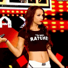 a woman wearing a crop top that says i 'm not ratchet