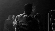 a man in a fur coat is smoking a cigarette