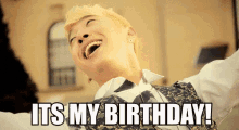 a man is laughing with the words " it 's my birthday " written below him