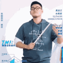 a man wearing a hoodie that says einstein 's formula