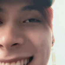 a close up of a person 's face with red hair and a hat .