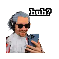 a man wearing a wig and sunglasses is holding a cell phone with the word huh behind him