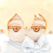 a close up of a stuffed animal with a bow tie on