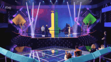 a group of people standing on a stage with the word rtve on the bottom