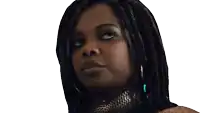 a close up of a woman 's face with dreadlocks looking up