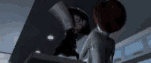 a couple of people standing next to each other in a dark room .