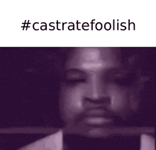 a close up of a man 's face with a sword in his mouth and the words `` castrate foolish '' .