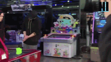a man stands in front of a machine that says ' bubbles ' on it