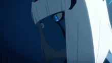 a close up of a person 's face with blue eyes