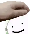 a close up of a hand holding a smiley face on top of a clock .