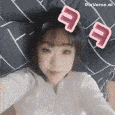 a girl is laying on a bed with pixverse.ai written on the bottom