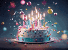 a birthday cake with candles and confetti on it