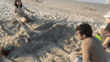 haciendo una sirena beach sand buried