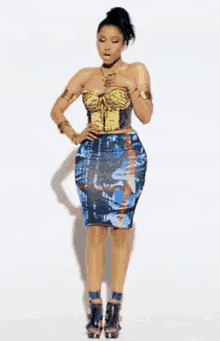 a woman wearing a corset top and a skirt is standing with her hands on her hips